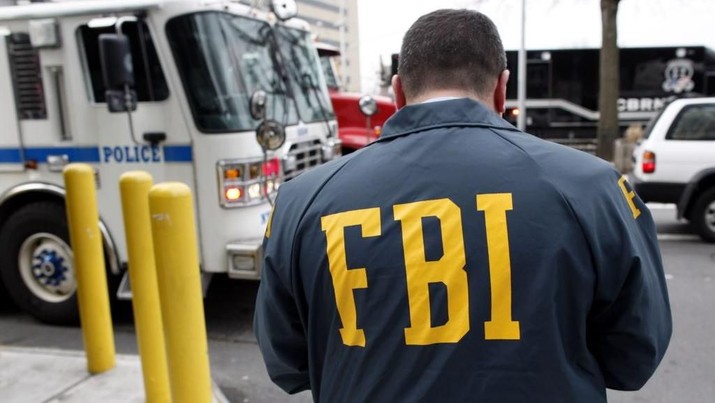 An FBI Special Agent is seen in Queens, New York March 25, 2010. REUTERS/Chip East