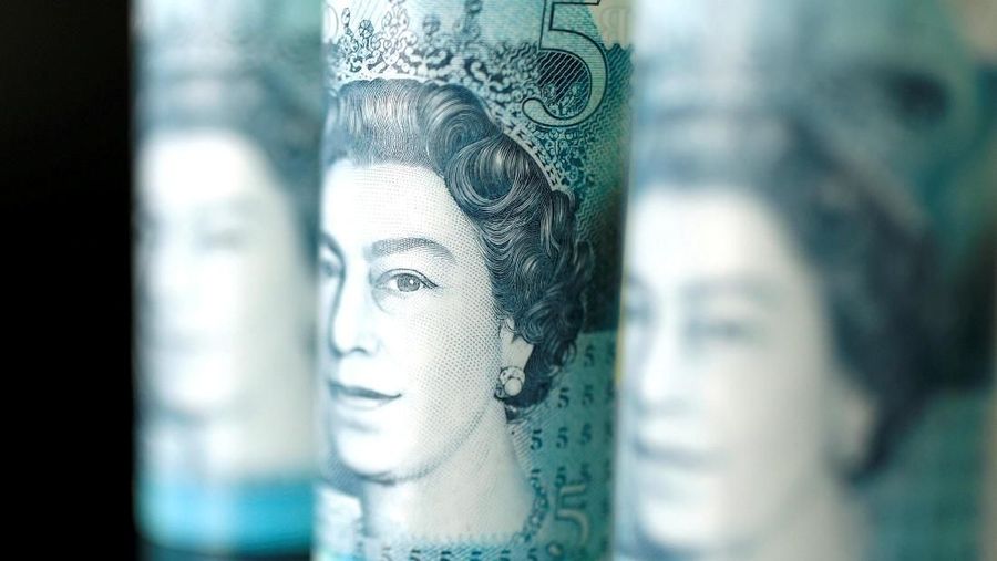 FILE PHOTO: British five pound banknotes are seen in this picture illustration taken November 14, 2017. REUTERS/ Benoit Tessier/Illustration/File Photo