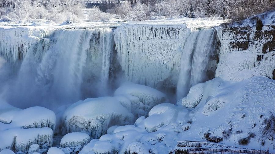 The Table Rock Welcome Centre overlooks a snow and ice covered American Falls, viewed from Niagara Falls, Ontario, Canada, Thursday, Jan. 31, 2019. (Tara Walton/The Canadian Press via AP)