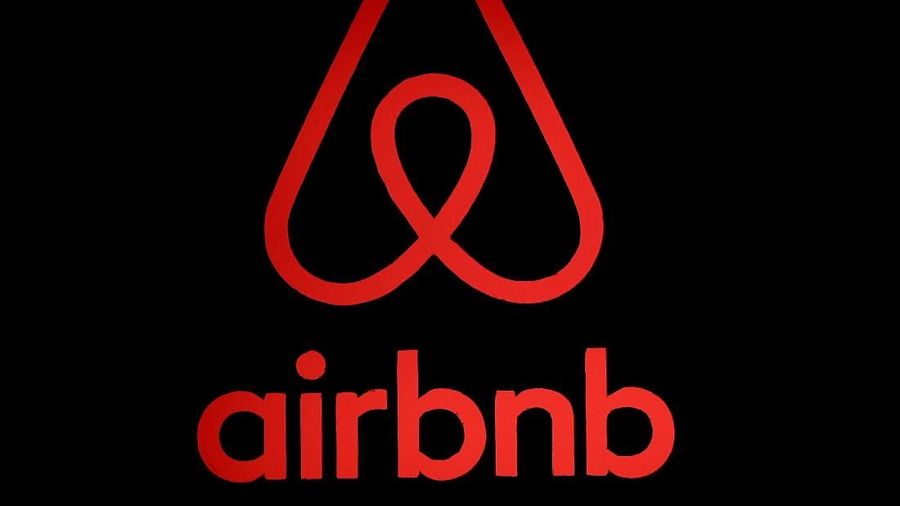 FILE PHOTO: The logo of Airbnb is displayed at an Airbnb event in Tokyo, Japan, June 14, 2018. REUTERS/Issei Kato/File Photo