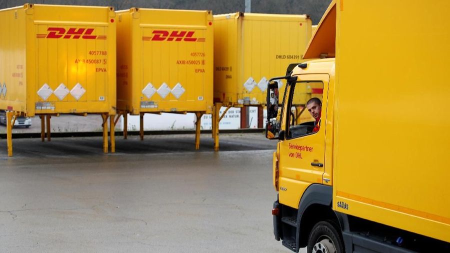 FILE PHOTO: Patrick Klankert, a 27-year-old truck driver of German postal and logistics group Deutsche Post DHL steers his truck at a DHL freight logistics centre located near the crossroads of Germany, France and Luxembourg in Sehlem, Germany, December 12, 2018.  REUTERS/Wolfgang Rattay/File Photo