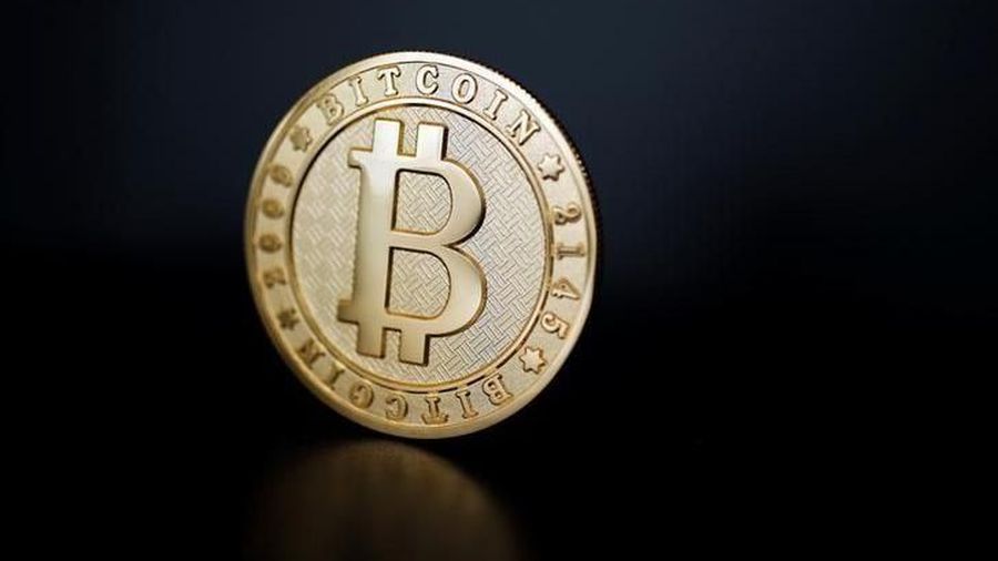 A Bitcoin (virtual currency) coin is seen in an illustration picture taken at La Maison du Bitcoin in Paris, France, June 23, 2017. REUTERS/Benoit Tessier/Illustration