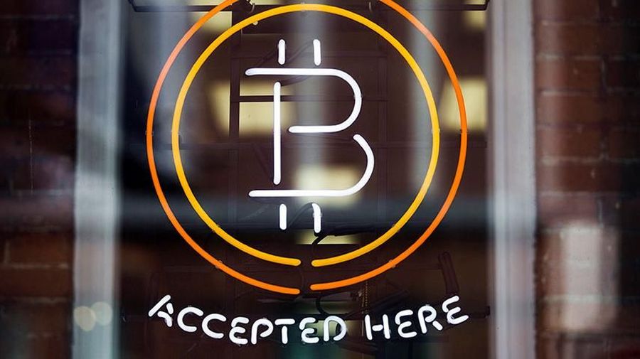BUYING POWER: A Bitcoin sign in a window in Toronto, May 8, 2014.  REUTERS/Mark Blinch