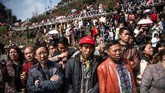 Etnis itu adalah minoritas dan yang paling banyak ditemukan di barat daya China. (Photo by FRED DUFOUR / AFP)