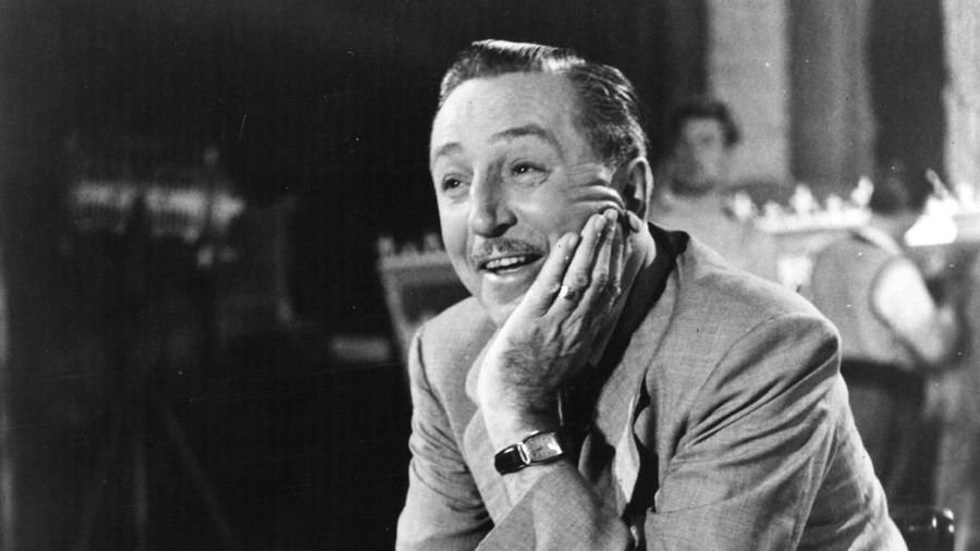 22nd June 1951:  US artist and film producer Walt Disney (1901 - 1966), creator of Mickey Mouse, seated at a desk with paperwork in London.  (Photo by Topical Press Agency/Getty Images)