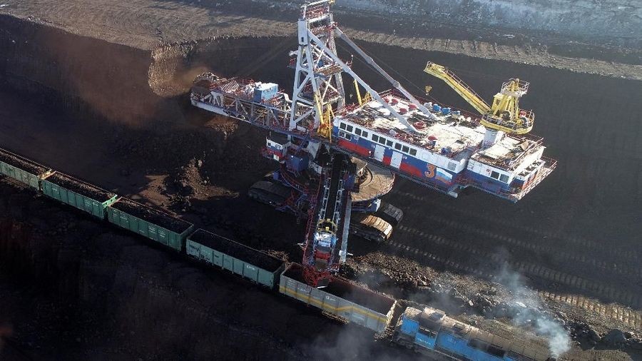 A rotary dredge loads wagons with coal at Borodinsky opencast colliery, owned by the Siberian Coal Energy Company (SUEK), near the Siberian town of Borodino east of Krasnoyarsk, Russia February 26, 2019. Picture taken February 26, 2019. REUTERS/Ilya Naymushin