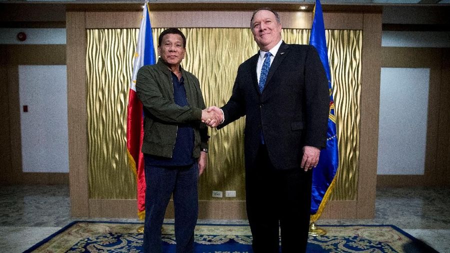 U.S. Secretary of State Mike Pompeo shakes hands with Philippines President Rodrigo Duterte at Colonel Jesus Villamor Airbase in Manila, Philippines February 28, 2019. Andrew Harnik/Pool via Reuters