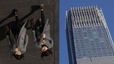 Bayangan perempuan tercermin pada panel-panel perak toko merek barang mewah Louis Vuitton di Distrik Bisnis di Beijing. (AP/Andy Wong)