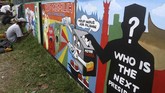 Mural dinilai dapat membantu meningkatkan partisipasi masyarakat untk memilih pada Pemilu 2019. Dengan melihat mural, masyarakat diharapkan tergerak ke TPS. (ANTARA FOTO/Muhammad Arif Pribadi)