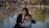 Biasanya bunga sakura di Taman Yuyuantan mekar pada bulan Maret hingga April. (Nicolas ASFOURI / AFP)