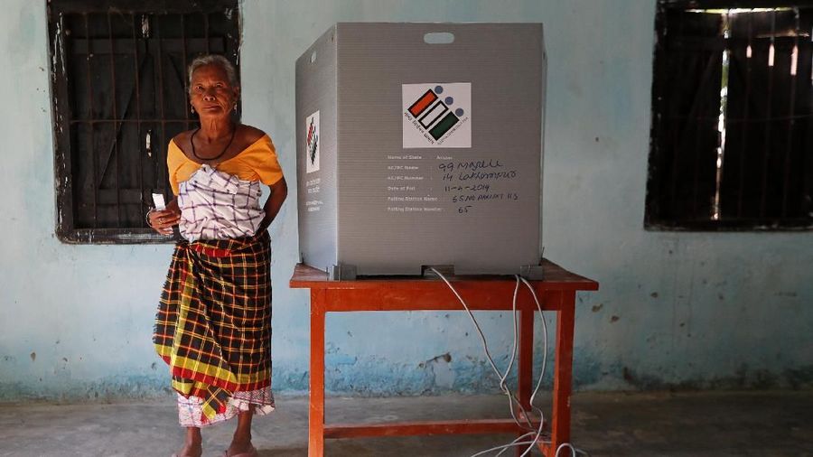 A woman leaves after casting her vote at a polling station in Majuli, a large river island in the Brahmaputra river, in the northeastern Indian state of Assam, India April 11, 2019. REUTERS/Adnan Abidi