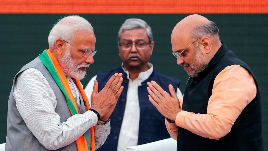 Indian Prime Minister Narendra Modi and chief of India's ruling Bharatiya Janata Party (BJP) Amit Shah, greet each other before releasing their party's election manifesto for the April/May general election in New Delhi, India, April 8, 2019. REUTERS/Adnan Abidi TPX IMAGES OF THE DAY
