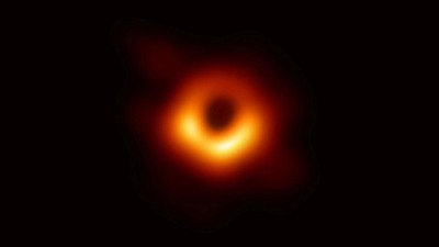 REFILE - CORRECTING SPELLING The first ever photo of a black hole, taken using a global network of telescopes, conducted by the Event Horizon Telescope (EHT) project, to gain insight into celestial objects with gravitational fields so strong that no matter or light can escape, is shown in this handout released April 10, 2019.  Event Horizon Telescope (EHT)/National Science Foundation/Handout via REUTERS