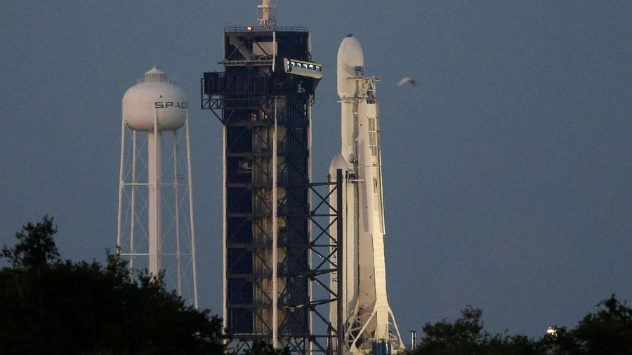 A SpaceX Falcon Heavy rocket with the Arabsat 6A communications satellite aboard is shown after launch was delayed for weather at the Kennedy Space Center in Cape Canaveral, Florida, U.S., April 10, 2019.  REUTERS/Charles W. Luzier