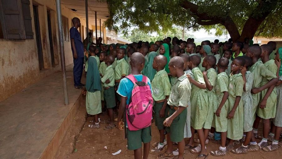 Nine sets of twins gather after a midday break at the Methodist school in Igbo Ora, Oyo State, Nigeria April 3, 2019. PIcture taken April 3, 2019. REUTERS/Afolabi Sotunde