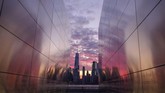 Sinar mentari pagi menerangi langit kota New York dan terlihat dibingkai oleh memorial Empty Sky di area Jersey City. (AP Photo/J. David Ake)