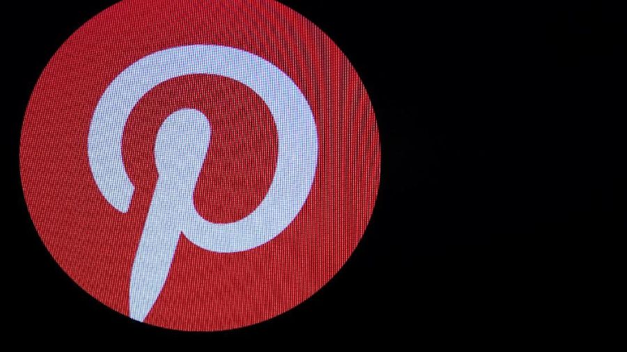 Screens display the company logo and trading information for Pinterest Inc. during the company's IPO on the front of the New York Stock Exchange (NYSE) in New York, U.S., April 18, 2019. REUTERS/Brendan McDermid
