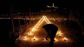 Kamis Putih diperingati sebagai lambang dari Perjamuan Terakhir yang dilakukan Yesus dan 12 rasulnya. (Reuters/Darrin Zammit Lupi)
