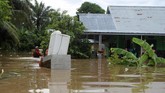 Saat ini banjir sebagian sudah surut di beberapa wiayah wilayah. Namun banjir masih banyak menggenangi permukiman di beberapa wilayah (DIVA MARHA / AFP)