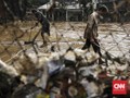 FOTO: Lumpur Sisa Banjir Jakarta