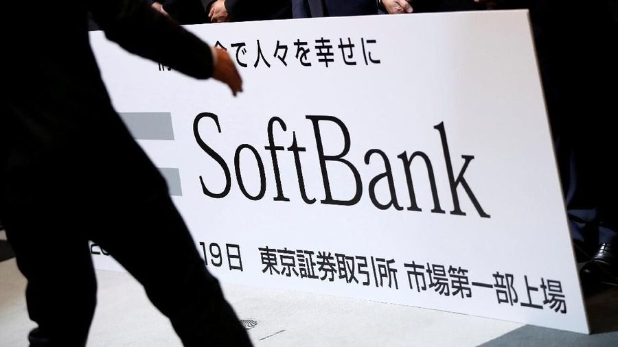 FILE PHOTO: SoftBank Corp. placard is prepared during a ceremony to mark the company's debut on the Tokyo Stock Exchange in Tokyo, Japan December 19, 2018.   REUTERS/Issei Kato/File Photo  GLOBAL BUSINESS WEEK AHEAD