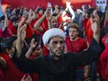 FOTO : Lantunan Musik Rap dan Ibadah Kaum Syiah Irak