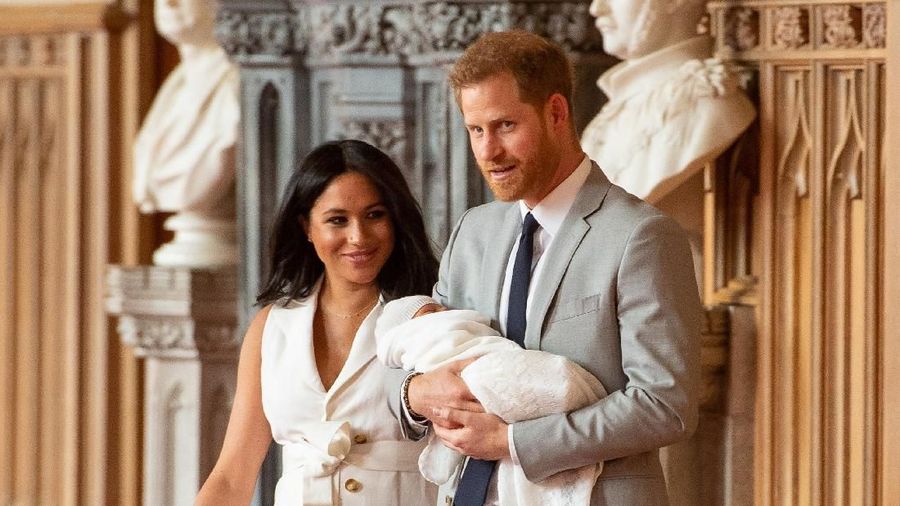 Britain's Prince Harry and Meghan, Duchess of Sussex are seen with their baby son, who was born on Monday morning, during a photocall in St George's Hall at Windsor Castle, in Berkshire, Britain May 8, 2019. Dominic Lipinski/Pool via REUTERS