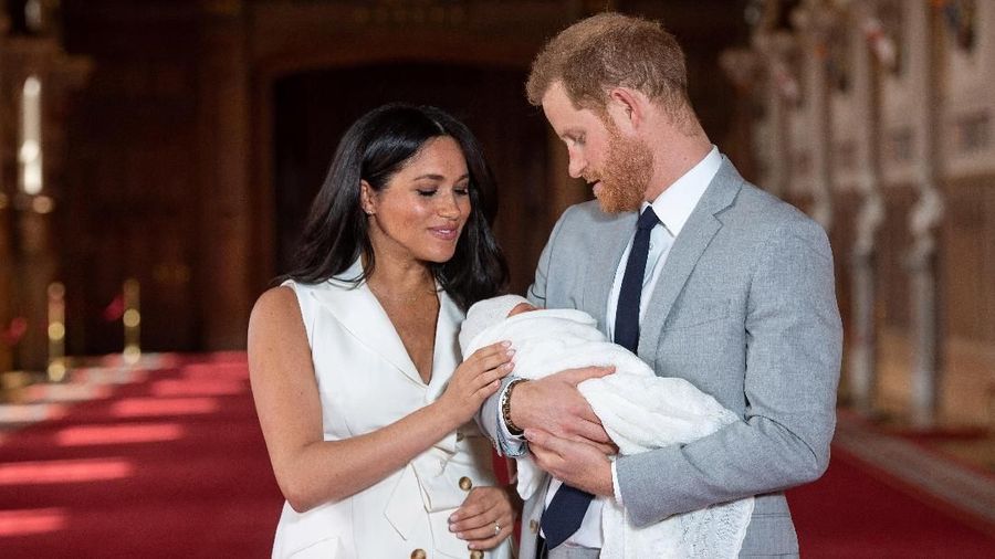 Britain's Prince Harry and Meghan, Duchess of Sussex are seen with their baby son, who was born on Monday morning, during a photocall in St George's Hall at Windsor Castle, in Berkshire, Britain May 8, 2019. Dominic Lipinski/Pool via REUTERS