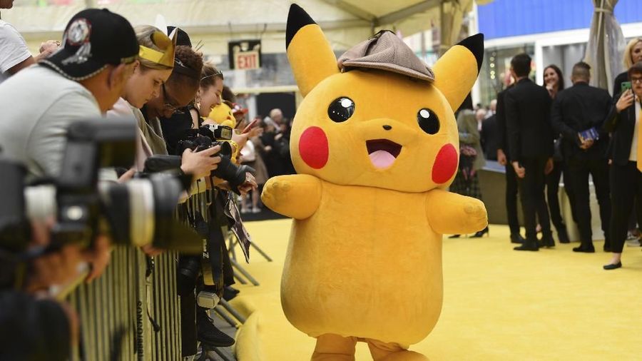A person in a Pikachu character costume attends the premiere of
