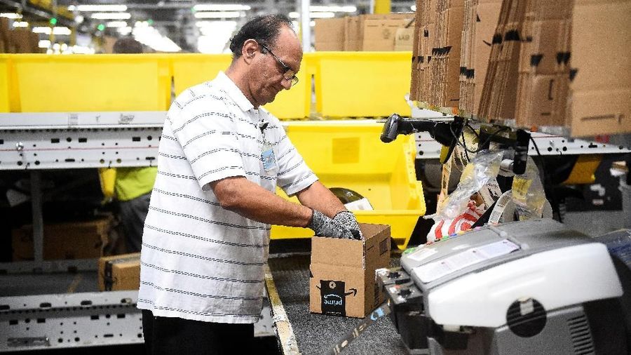 FILE PHOTO: Products, stacked on shelves, are seen at the Amazon fulfillment center in Baltimore, Maryland, U.S., April 30, 2019. REUTERS/Clodagh Kilcoyne/File Photo