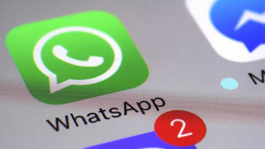 FILE - This Friday, March 10, 2017, file photo shows the WhatsApp communications app on a smartphone, in New York. WhatsApp says a vulnerability in the popular communications app let mobile phones be infected with sophisticated spyware with a missed in-app call alone. (AP Photo/Patrick Sison, File)