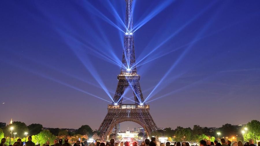 The Eiffel tower is illuminated during a light show to celebrate its 130th anniversary in Paris, France, May, 15, 2019. REUTERS/Gonzalo Fuentes