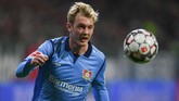 Finalis Liga Champions Tottenham Hotspur ingin melakukan peremajaan skuatnya di musim depan dengan merekrut gelandang muda Bayer Leverkusen Julian Brandt berdasarkan laporan Daily Mail. (Patrik STOLLARZ / AFP)