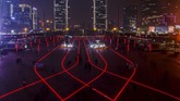 Cahaya lampu LED di depan stasiun kereta cepat di distrik bisnis di Zhengzhou, Provinsi Henan, China. (Reuters/Thomas Peter)