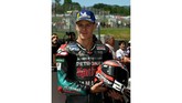 Pebalap Petronas Yamaha Fabio Quartararo merayakan start kedua MotoGP Italia 2019 di parc ferme Sirkuit Mugello. (Claudio Giovannini/ANSA via AP)