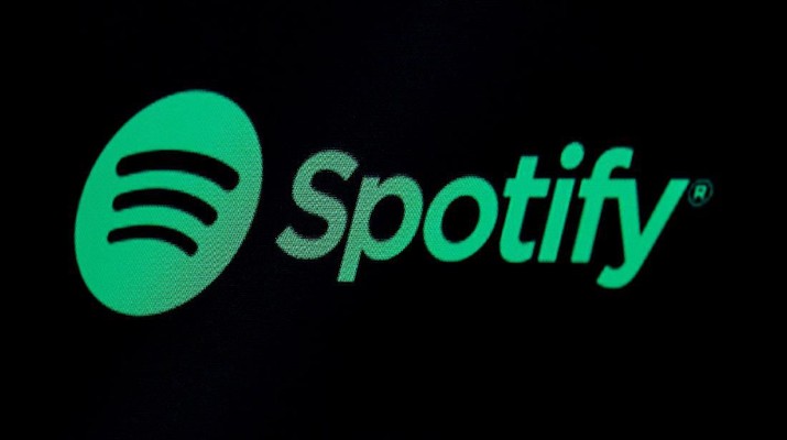 FILE PHOTO: The Spotify logo is displayed on a screen on the floor of the New York Stock Exchange (NYSE) in New York, U.S., May 3, 2018. REUTERS/Brendan McDermid/File Photo