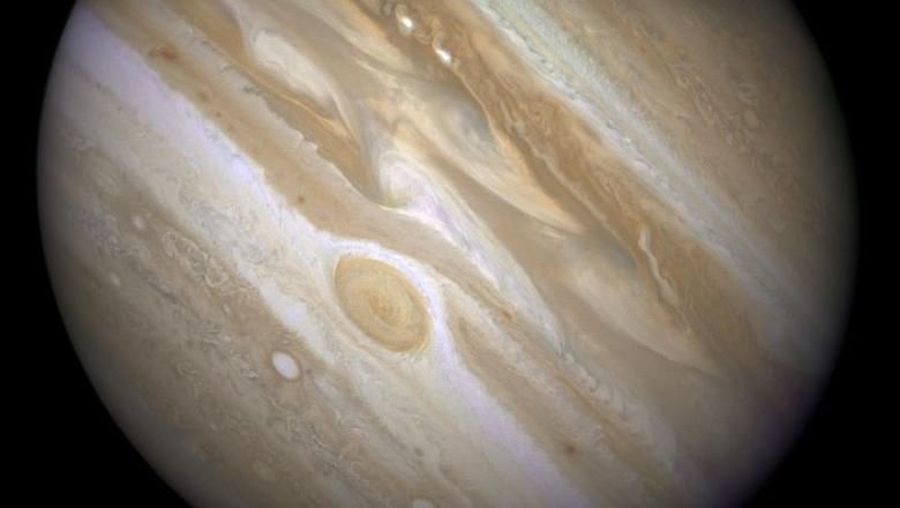 The planet Jupiter is shown with one of its moons, Ganymede (bottom), in this NASA handout taken April 9, 2007 and obtained by Reuters March 12, 2015. REUTERS/NASA/ESA and E. Karkoschka/Handout via Reuters