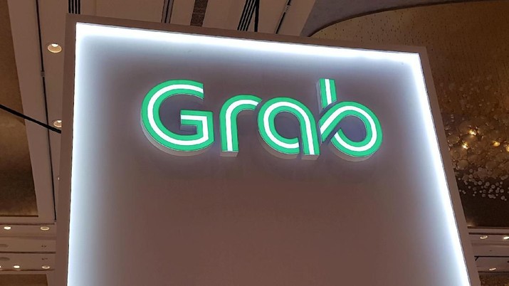 FILE PHOTO: A Grab logo is pictured at the Money 20/20 Asia Fintech Trade Show in Singapore March 21, 2019. Picture taken March 21, 2019. REUTERS/Anshuman Daga/File Photo