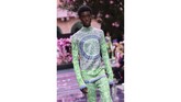 Milan Fashion Week untuk berbagai busana mewah diceriakan dengan berbagai busana dari Versace. (Miguel MEDINA / AFP)