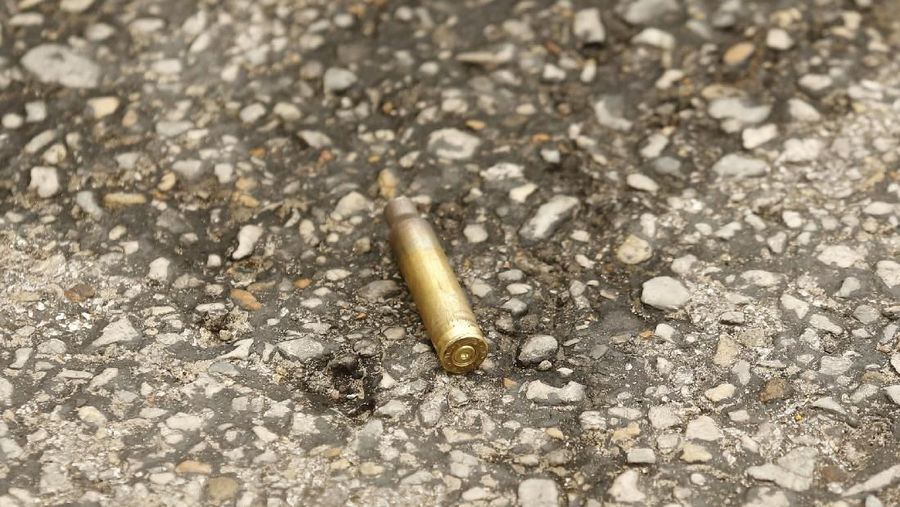 A shell casing lays on the ground after shots were fired Monday, June 17, 2019, at the Earle Cabell Federal Building in downtown Dallas. Law enforcement returned fire and the shooter was hit by gunfire. (Tom Fox/The Dallas Morning News) MANDATORY CREDIT, NO SALES, MAGS OUT, TV OUT, INTERNET USE BY AP MEMBERS ONLY