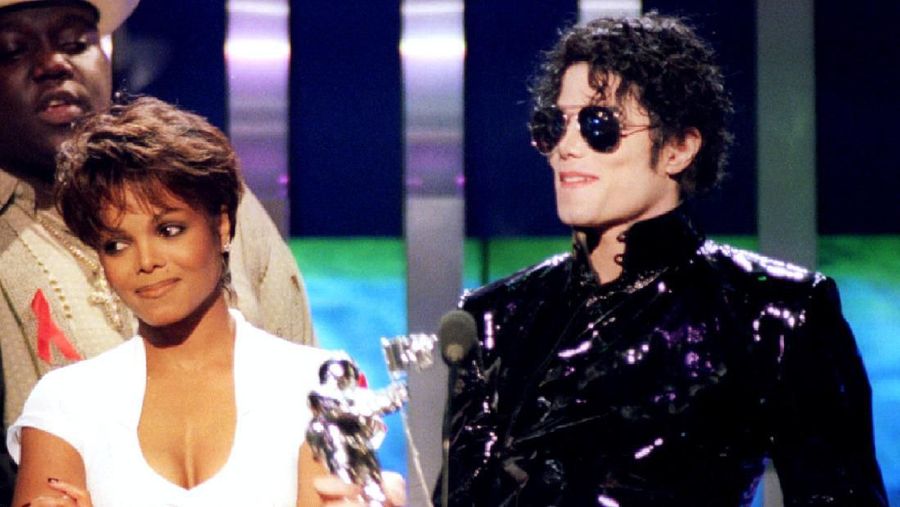 FILE PHOTO: Singer Janet Jackson (L) and her brother Michael Jackson accept an award for 