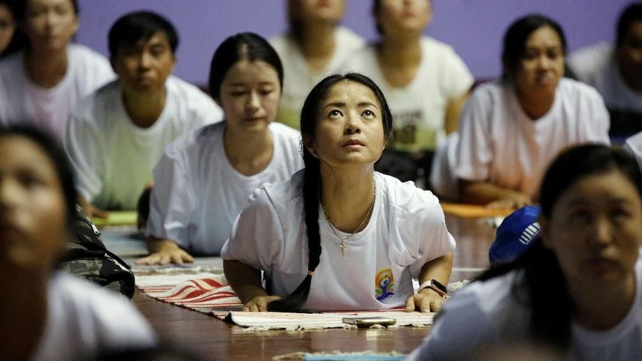 Hundreds gather to practice yoga to mark the 5th International Yoga Day in Yangon, Myanmar, June 15, 2019. REUTERS/Ann Wang