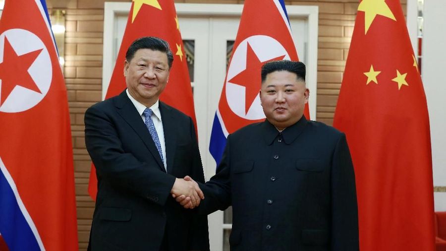 North Korean leader Kim Jong Un welcomes Chinese President Xi Jinping at the Pyongyang International Airport in Pyongyang, North Korea, in this undated photo released on June 21, 2019 by North Korea's Korean Central News Agency (KCNA). KCNA via REUTERS ATTENTION EDITORS - THIS IMAGE WAS PROVIDED BY A THIRD PARTY. REUTERS IS UNABLE TO INDEPENDENTLY VERIFY THIS IMAGE. NO THIRD PARTY SALES. SOUTH KOREA OUT. NO COMMERCIAL OR EDITORIAL SALES IN SOUTH KOREA. TPX IMAGES OF THE DAY
