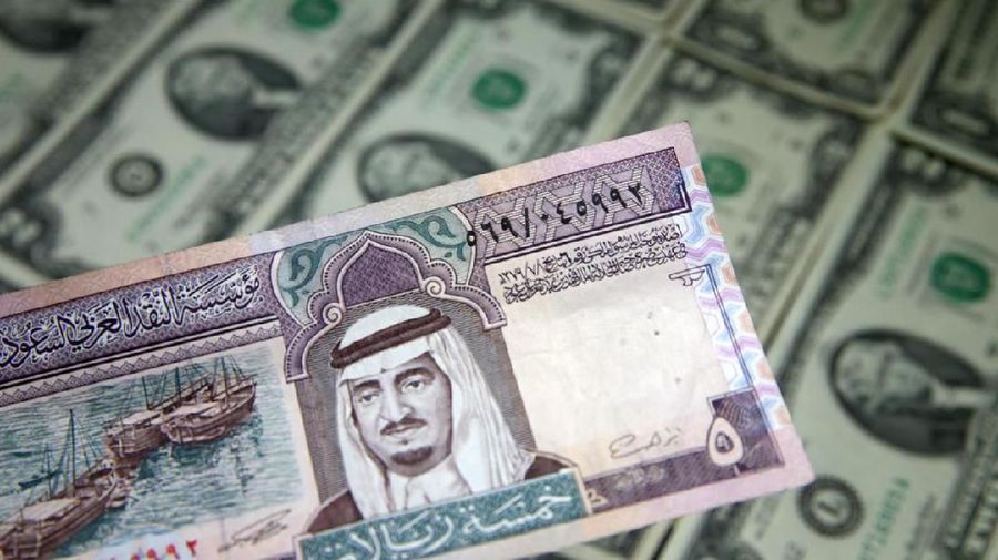 Dollar and Riyal banknotes are seen in this picture illustration taken May 8, 2017. Picture taken May 8, 2017. REUTERS/Dado Ruvic/Illustration