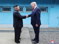 U.S. President Donald Trump shakes hands with North Korean leader Kim Jong Un as they meet at the demilitarized zone separating the two Koreas, in Panmunjom, South Korea, June 30, 2019. KCNA via REUTERS    ATTENTION EDITORS - THIS IMAGE WAS PROVIDED