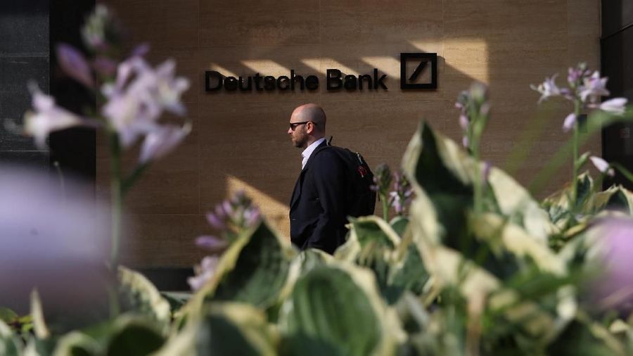 People walk past a Deutsche Bank office in London, Britain July 8, 2019. REUTERS/Simon Dawson