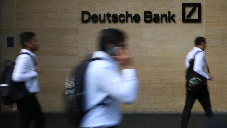 People walk past a Deutsche Bank office in London, Britain July 8, 2019. REUTERS/Simon Dawson