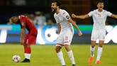 Pemain Tunisia Taha Yassine Khenissi teriak kegirangan usai timnya dipastikan lolos ke semifinal Piala Afrika 2019. Tunisia pada 2004 sukses meraih juara Piala Afrika. (REUTERS/Amr Abdallah Dalsh)