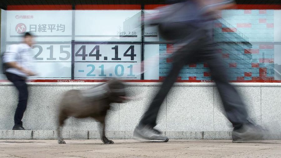 An electronic stock board showing Japan's Nikkei 225 index at a securities firm is seen on a street in Tokyo Wednesday, July 10, 2019. Asian shares were mostly higher Wednesday in cautious trading ahead of closely watched congressional testimony by the U.S. Federal Reserve chairman. (AP Photo/Eugene Hoshiko)