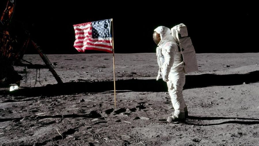 FILE PHOTO: Astronaut Buzz Aldrin, lunar module pilot for Apollo 11, poses for a photograph besides the deployed United States flag during an extravehicular activity (EVA) on the moon, July 20, 1969. The lunar module (LM) is on the left, and the footprints of the astronauts are visible in the soil. Neil Armstrong/NASA/Handout via REUTERS/File Photo   ATTENTION EDITORS - THIS IMAGE HAS BEEN SUPPLIED BY A THIRD PARTY     TPX IMAGES OF THE DAY    PLEASE SEARCH 